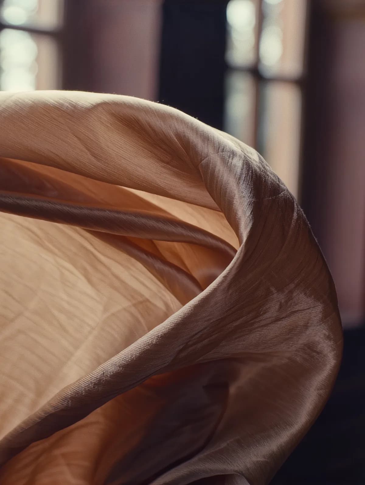 Champagne silk fabric catching soft light